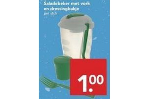 saladebeker met vork en dressingbakje